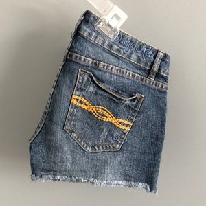 Distressed denim shorts